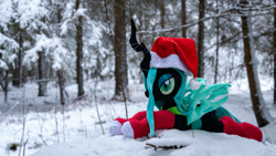 Size: 1192x670 | Tagged: safe, artist:mgrdash, imported from derpibooru, queen chrysalis, changedling, changeling, pony, christmas, christmas changeling, clothes, hat, holiday, irl, outdoors, photo, ponies in real life, santa hat, snow, socks, solo, stockings, thigh highs, winter, winter outfit