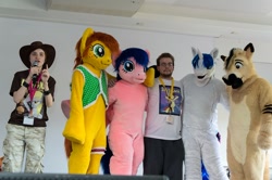 Size: 1024x681 | Tagged: safe, artist:atalonthedeer, imported from derpibooru, firefly, shining armor, oc, oc:canni soda, human, 2012, furry, furry oc, fursuit, g1, galacon, group, indoors, irl, irl human, photo, ponysuit, stage