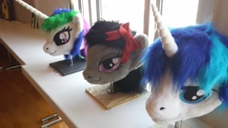 Size: 4128x2322 | Tagged: safe, artist:atalonthedeer, imported from derpibooru, octavia melody, princess celestia, shining armor, 2013, disembodied head, fursuit head, galacon, irl, photo, ponysuit, table, trio