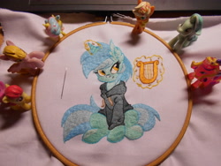 Size: 5152x3864 | Tagged: safe, artist:ambris, artist:lightdragon1988, imported from derpibooru, lyra heartstrings, pony, unicorn, clothes, dig the swell hoodie, ear fluff, embroidery, hoodie, horn, irl, lyre, magic, magic aura, musical instrument, photo, sitting, smiling, telekinesis, toy