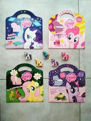 Size: 1224x1632 | Tagged: safe, artist:justyna trzaska, imported from derpibooru, fluttershy, pinkie pie, rainbow dash, rarity, twilight sparkle, chipmunk, earth pony, pegasus, unicorn, background pony applejack, book, clothes, egmont, female, figurine, horn, irl, male, mare, meadow mild, merchandise, official, photo, polish, stallion, toy, unicorn twilight, uniform, wonderbolts uniform